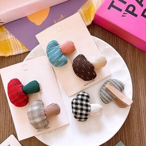 Pair of cute checkered mushroom hair clips for girls on a gift card in a white bowl