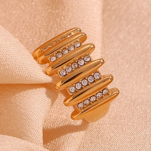 Close-up of a wide 18K gold plated stainless steel ring with micro-pave clear zircon stones
