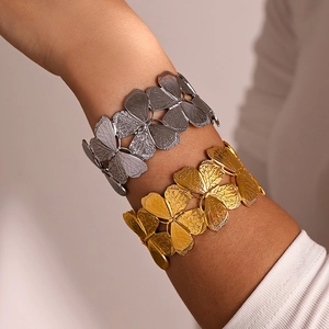 Floral cutout open cuff bracelets in gold and silver finish with detailed leaf textures