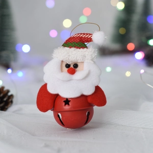 Detail of Santa Claus ornament with red glitter hat and metallic bell with star cutout