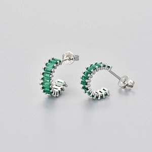 S925 silver hoop earrings featuring emerald-cut green cubic zirconia stones in detail