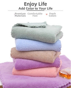 Detailed close-up of thick microfiber towels in multiple pastel colors with fluffy texture