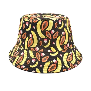 Reversible bucket hat with black tropical banana and papaya print for sun protection