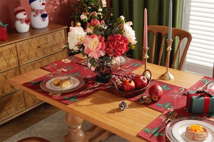 Detailed Christmas table runner and placemat set with festive holiday pattern on wood table