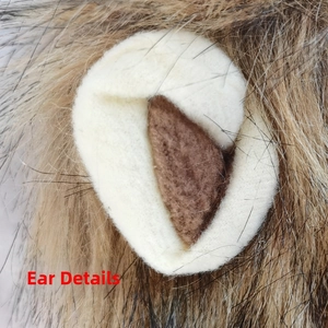Close-up detail of soft faux fur lion ear for cat costume with realistic brown plush texture