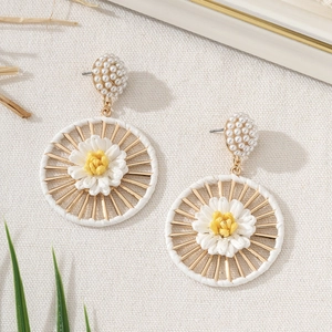 Bohemian handmade raffia flower earrings with pearls and gold metal daisy sunburst design