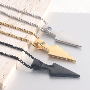 Detailed shot of 304 stainless steel arrow pendants in silver, gold, and black finishes