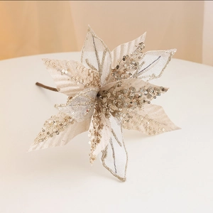 Elegant cream Christmas poinsettia with gold sequins and glitter for festive wreaths