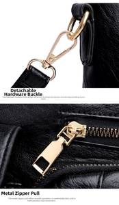 Detailed macro view of light gold hardware clasp and zipper on black pebbled leather bag