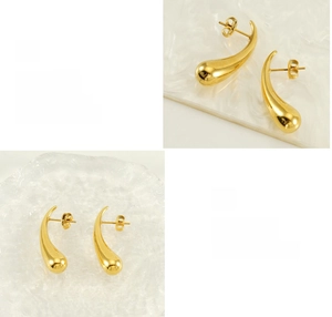 Detail of gold teardrop earrings showing high-polish mirror finish and smooth electroplating