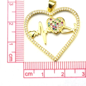 Detailed view of gold heart pendant with ECG line and micro-pave zircons and scale measurement