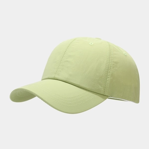 Detail of light green waterproof baseball cap with breathable fabric and curved brim