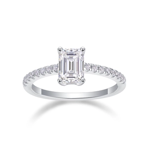 Close-up of emerald-cut moissanite ring with side accent stones in S925 sterling silver