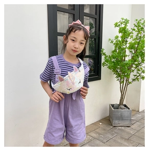 Girl wearing a shiny sequin unicorn chest bag with 3D ears and colorful details