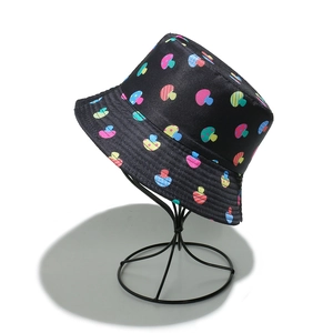 Close-up of black bucket hat featuring colorful mushroom prints and reinforced brim stitching