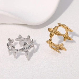 Minimalist adjustable leaf ring in gold and silver finish with hollow floral design