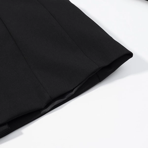 Detail of high-density black fabric texture with premium diagonal twill weave on suit set
