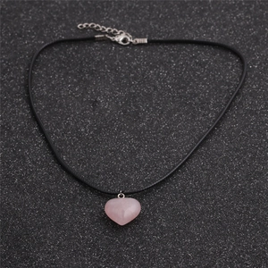 Pink quartz heart pendant necklace featuring black wax cord and silver adjustable chain