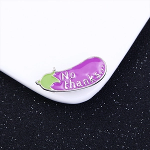 Creative purple eggplant enamel brooch with green leaf and No Thanks text on white background