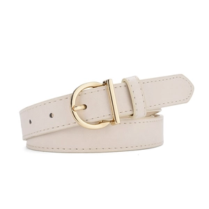 Detail of cream white leather belt with gold horseshoe buckle and fine stitching