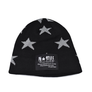 Detail of knitted beanie with grey star patterns and central black woven logo patch