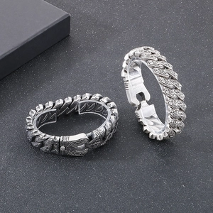 Retro stainless steel chain bracelet with intricate vintage floral engraving for men
