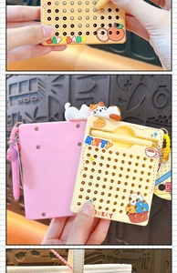 Close-up of cat-themed magnetic bead drawing board with pen for creative fun play