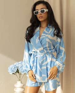 Detail of blue zebra pattern lounge set with waist tie and smooth satin texture