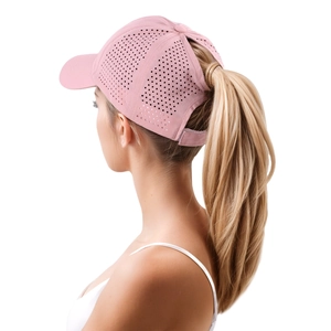 Detail of pink ponytail baseball cap showing laser-cut ventilation holes and velcro strap