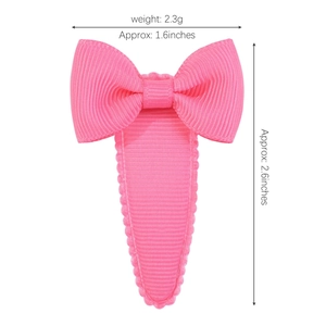 Hot pink grosgrain ribbon bow hair clip with measurement details for toddlers