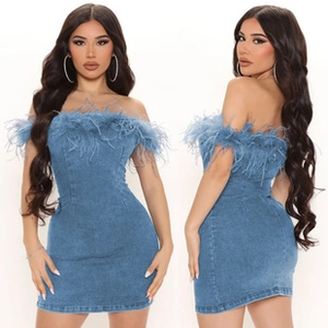 Detail view of a blue denim mini dress with ostrich feather trim on the neckline