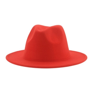 Detailed close-up of a red wool fedora hat showing texture and brim stitching