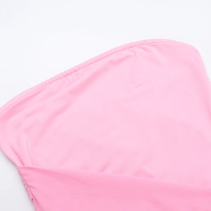 Detail of pink knitted fabric showing fine stitching and premium elastic texture
