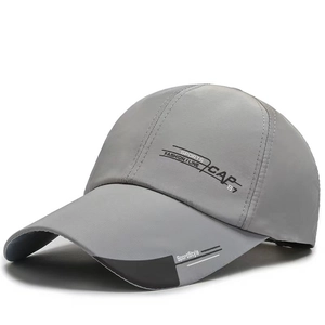 Detailed side view of a grey fashion baseball cap featuring sports print and extended visor