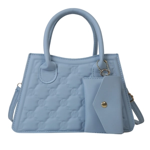 Quilted light blue handbag with matching small pouch and detachable shoulder strap