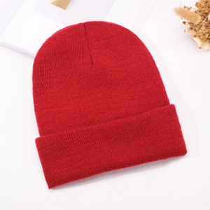 Women's red ribbed knit beanie with satin lining for hair protection and winter warmth