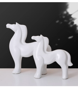 Macro view of minimalist white ceramic horse sculpture set with matte finish decor