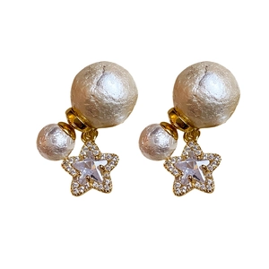 18K gold plated pearl earrings with sparkling diamond star charms on white background