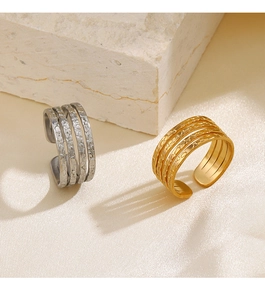 Macro detail of 4-layer hammered texture 18K gold and silver plated stainless steel rings
