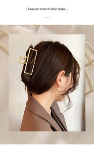 Detail of French vintage gold metal rectangular hair claw clip with strong spring