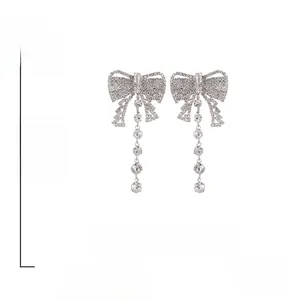 Detailed size specifications of bowknot tassel earrings with rhinestone and silver needle
