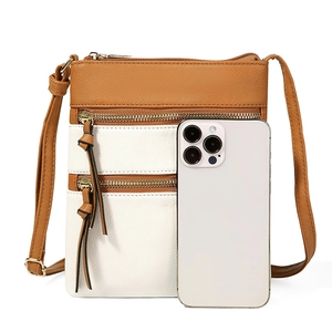 Detailed size comparison of brown crossbody bag with multi-layer zippers and a smartphone