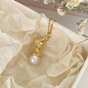 Elegant 10K gold bell pendant necklace with white pearl in a gift box arrangement
