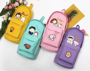 Detail showing colorful canvas pencil cases with cute cartoon characters and animal patches