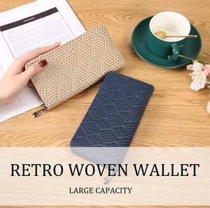 Detail view of retro woven long wallets in beige and navy with large capacity design
