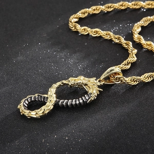 Macro view of infinity dragon pendant in gold and silver finish with twisted rope chain