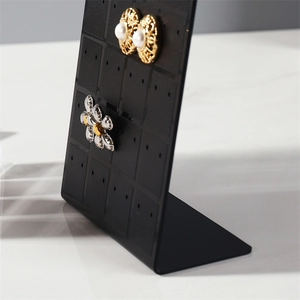 L-shaped black acrylic earring display stand with 48 holes for jewelry organization