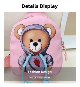 Detailed view of pink nylon kids chest bag featuring a stylish bear print with blue drawstrings