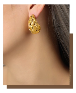 Close-up of gold-plated teardrop woven stud earrings featuring intricate mesh texture