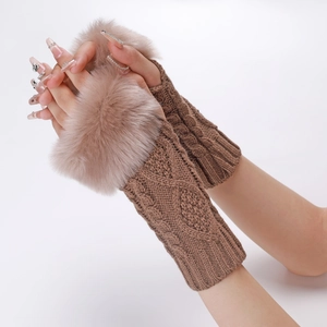 Detail of coffee brown knit arm warmers featuring braided texture and faux fur cuffs